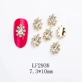 Detailed macro view of gold alloy crown nail charms with pear-shaped rhinestones, 7.3*10mm - Waterdrop-LF2938 / Gold/Iridescent
