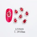 Macro view of crown-shaped red alloy nail charms with K9 crystals and teardrop stones - Waterdrop-LF2949 / Silver/Red