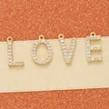 Colgantes de letras LOVE doradas con circonitas sobre una elegante cinta de raso - Letra A / Dorado
