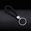 Portachiavi in pelle nera intrecciata con anello in metallo argento lucido su fondo scuro - 30*1.6mm / Nero