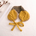 Detail of yellow and grey knitted kids earmuff scarf with warm plush lining and braided ties - Yellow + Khaki