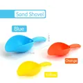 Three colorful plastic sand shovels in blue, orange, and yellow for kids' outdoor play - Soft Rubber Sand Shovel