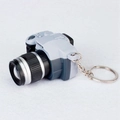 Miniature SLR camera keychain in grey finish with realistic lens details and metal ring - Gray