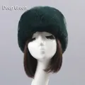 Thick dark green faux fur beanie hat for winter warmth shown on a model head stand - One Size / Dark Green