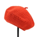 Detailed macro view of bright orange hand-crocheted wool beret with thick knit texture - M (56-58cm) / Orange