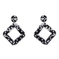 Detail of handmade geometric diamond-shaped beaded earrings with black and white checkerboard pattern - Black and White