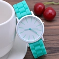 Minimalist mint green silicone quartz watch for women shown leaning on a white cup - Lake Blue
