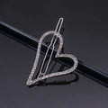 Close-up of a silver heart-shaped hair clip with shimmering rhinestones on a sleek surface - Silver Single Heart Rhinestone Frog Clip