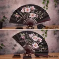 Classic black silk folding fan featuring pink peony painting and dark red wood frame - 10 Inch Black Peony
