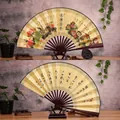 Classic 10 inch Chinese folding fan featuring golden peony peacock and calligraphy art - 10-Inch Flowers Blooming for Wealth