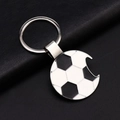Soccer ball metal keychain with bottle opener feature on black textured background - Football Bottle Opener