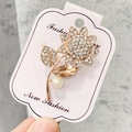 Broche tournesol élégante en or rose avec strass blancs et cristal de champagne - A7-17