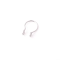 Close-up of a silver stainless steel horseshoe septum ring with ball ends on a white background - Steel