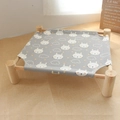Cat hammock with light wood frame and grey canvas bed featuring white rabbit patterns - Grey Rabbit