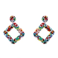 Macro shot of colorful handmade geometric beaded earrings with vibrant bohemian patterns - Colorful