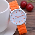 Classic slim quartz watch featuring an orange silicone strap and white round dial - Orange