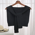 Elegant black knitted decorative shawl with long ties shown on a wooden hanger - Solid Black