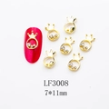 Detailed close-up of 7x11mm golden crown nail charms with rhinestones and pink display - Crown Shape (LF3008) / 1 Piece