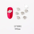 Detail of Saturn-shaped silver nail charms with clear rhinestones, size 9x6mm - Silver Planet Style (LF3001)