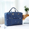 Foldable navy blue travel bag with geometric patterns on a white bed sheet - Thickened Navy Geometric