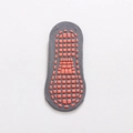 Grey low-cut yoga sock featuring orange anti-slip silicone grip dots on the sole - Gray