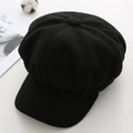 Top-down view of a vintage black wool baker boy hat with classic paneled crown detail - M (56-58cm) / Black