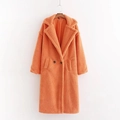 Detail of long orange teddy fleece coat featuring lapel collar, buttons and pockets - S / Tops / Orange