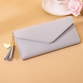 Close-up of lavender envelope wallet with gold heart charm and tassel detail - Long Style / Gray
