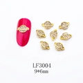 Golden Saturn shaped nail charm LF3004 with white rhinestones and pink nail display - Gold Planet Style (LF3004)