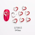 Macro view of LF3015 hollow heart nail art charm with red crystal and silver alloy base - Heart Shape (LF3015) / 1 Piece
