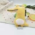 Close-up of yellow plush crocodile doll decoration with heart-patterned background - Yellow Crocodile (Original DIY Version)