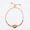 Détail du bracelet couronne doré réglable orné de zircons cubiques arc-en-ciel - Style b78-C (Couronne)