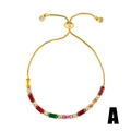 Detail of adjustable gold box chain bracelet with vibrant colorful zircon stone settings - Style b78-A (Geometric Colorful Stones)