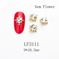 Macro detail of sun flower nail art jewelry with K9 crystal stone and gold metal claw - 3111 Crystal AB Gold Base Gem Flower (LF3111)