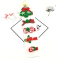 Close-up of 5-piece Christmas hair clip set with reindeer, tree and bows on display card - Christmas Tree 5-Piece Set