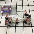 Detail of red and white striped LED candle string lights with clear battery power box - 1m 10-LED (2AA Battery Model) / Candle Light