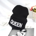 Black knitted beanie featuring white embroidered QUEEN text on a folded cuff - Black White QUEEN