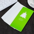 Biglietto di Natale 3D verde con albero ritagliato bianco e busta bianca abbinata - Piccolo albero verde