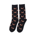Close-up of black crew socks featuring orange pixelated fox patterns and ribbed cuffs - Fox