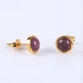 Gold stud earrings featuring round purple gemstone cabochons with bezel setting - Amethyst