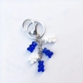 Close-up of candy color resin bears in blue and white on a silver metal keychain - Blue and White Combo