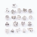 Flat lay of 20 silver DIY charm pendants including elephant bird and heart shapes - Mixed Large Hole Beads No.2 / 20 Pieces Set