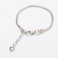 Silver snake chain bracelet with heart pendant and extension chain on white background - One Heart Bracelet 19