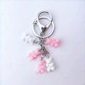 Close-up of pink and white resin bear charms with silver metal ring and lobster clasp - Pink and White Combo