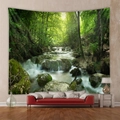 Detailed view of forest landscape tapestry hanging over a sofa in a modern living room - 73X95CM (Brushed Fabric) / Green Forest Stream and Mossy Rocks (GT100014)