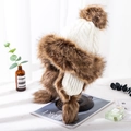 Knitted earflap hat in cream and brown faux fur with decorative pom-pom on display - M (56-58cm) / Mongolian Hat White