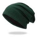 Detail of dark green knitted slouchy beanie with thick texture and black lining - Green