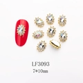 Macro detail of LF3093 vintage gold alloy nail art charms with 7x10mm k9 crystals - 3093 Crystal AB Gold Base Oval (LF3093)