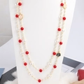 Elegant double-layered long necklace with red beads, white pearls and camellia flower charms - Red