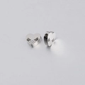 Macro view of heart-shaped stainless steel beads with wing texture and side hole - Hollow Angel Wing Heart (XKZ057) / Steel